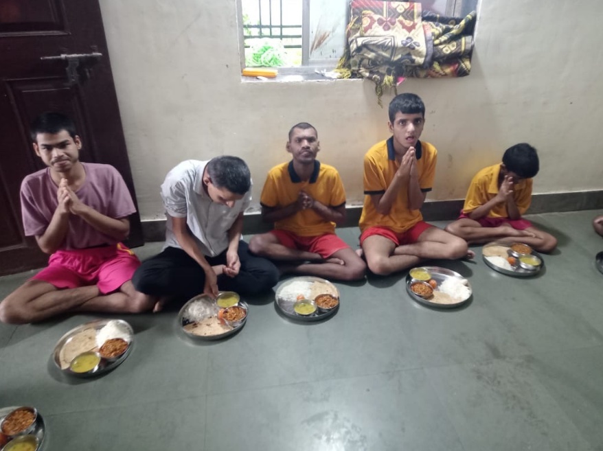 Children seated together for a meal at Kinara Residential School